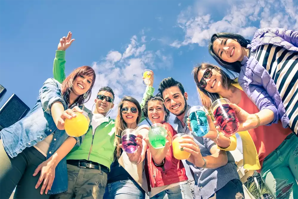 Coworkers attending a work party at an outdoor corporate venue